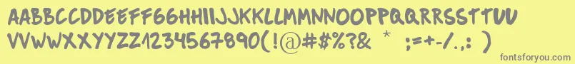 MuckySans-Schriftart – Graue Schriften auf gelbem Hintergrund