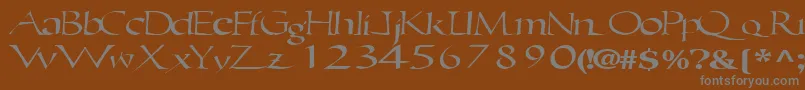 Ericbrush21RegularTtext-fontti – harmaat kirjasimet ruskealla taustalla