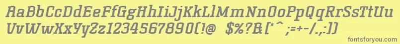 KorneuburgslabboldBolditalic-fontti – harmaat kirjasimet keltaisella taustalla