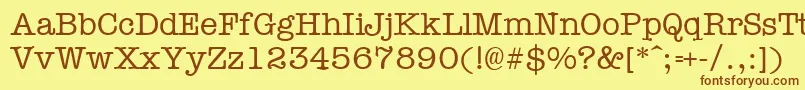 フォントTypewr – 茶色の文字が黄色の背景にあります。