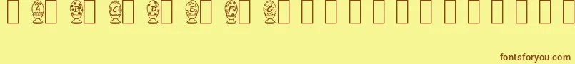 Fonte HappyEggsTrialVersion – fontes marrons em um fundo amarelo