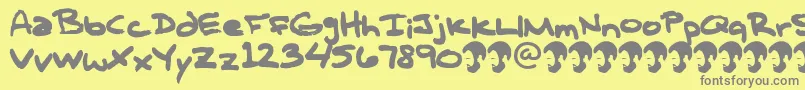 OpnTComplanaZ-Schriftart – Graue Schriften auf gelbem Hintergrund