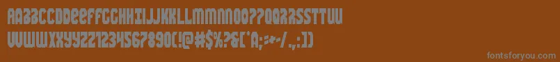 Warnationcond-fontti – harmaat kirjasimet ruskealla taustalla
