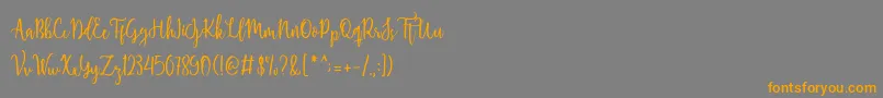 Shellaherascriptdemo-fontti – oranssit fontit harmaalla taustalla