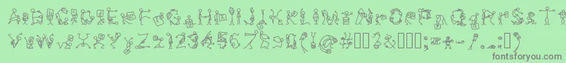 フォントStickfigures – 緑の背景に灰色の文字