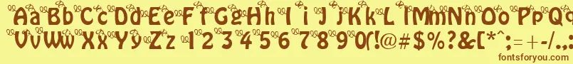 ThreeLittlePinkPigs Font – Brown Fonts on Yellow Background