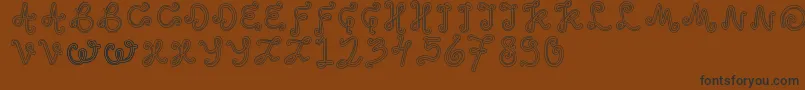 OddEthnic Font – Black Fonts on Brown Background