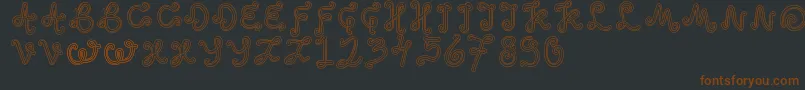 OddEthnic Font – Brown Fonts on Black Background