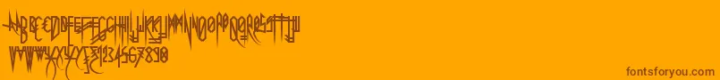 Czcionka Uglymann – brązowe czcionki na pomarańczowym tle