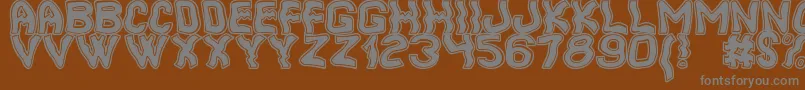 フォントCoolerSouthSt – 茶色の背景に灰色の文字