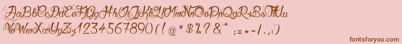 GueulesDeLoup-Schriftart – Braune Schriften auf rosa Hintergrund