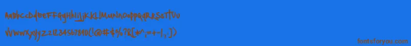 フォントBmdNotepaperAirplanes – 茶色の文字が青い背景にあります。