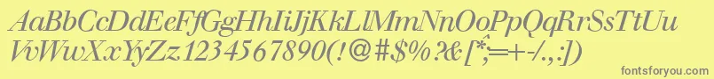 WalbaumdisplayItalic-fontti – harmaat kirjasimet keltaisella taustalla