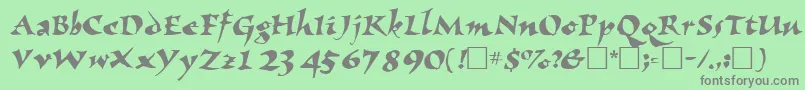 Fonte NomadscriptsskRegular – fontes cinzas em um fundo verde