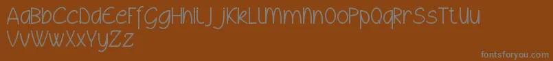 フォントWyllamdemo – 茶色の背景に灰色の文字