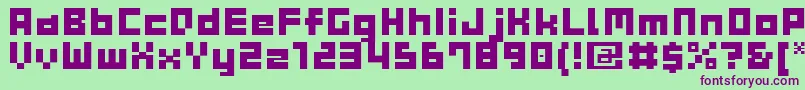 GauFontCubeB-fontti – violetit fontit vihreällä taustalla