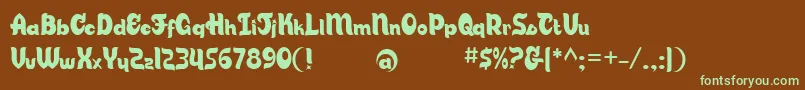 フォントCandsb – 緑色の文字が茶色の背景にあります。