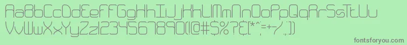 フォントQuarthin – 緑の背景に灰色の文字