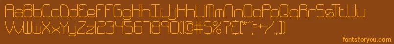 フォントQuarthin – オレンジ色の文字が茶色の背景にあります。