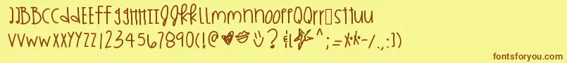 フォントKingskardashhh – 茶色の文字が黄色の背景にあります。