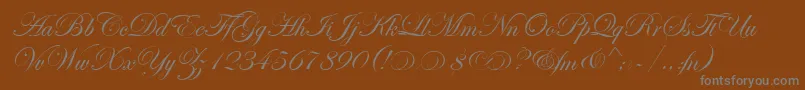 EdwardianScrAltItcTt-Schriftart – Graue Schriften auf braunem Hintergrund