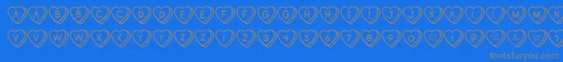 SweetHeartsBv-fontti – harmaat kirjasimet sinisellä taustalla