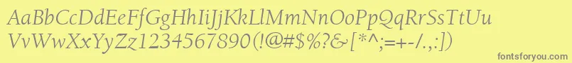 ItcBerkeleyOldstyleLtBookItalic-fontti – harmaat kirjasimet keltaisella taustalla