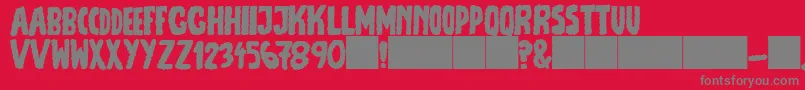 フォントJmhEscamasFill – 赤い背景に灰色の文字