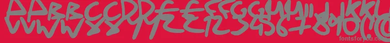 フォントDrunkHandwriting – 赤い背景に灰色の文字