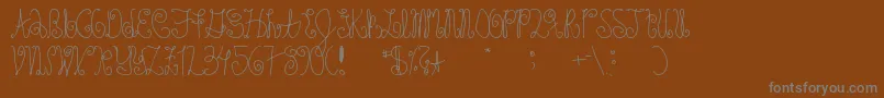 Schosszeit1-Schriftart – Graue Schriften auf braunem Hintergrund