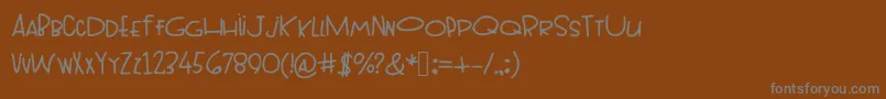 フォントTopheavy – 茶色の背景に灰色の文字