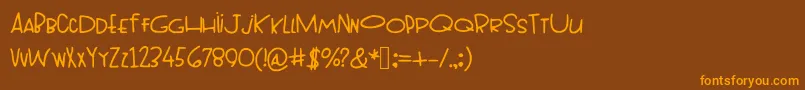 フォントTopheavy – オレンジ色の文字が茶色の背景にあります。