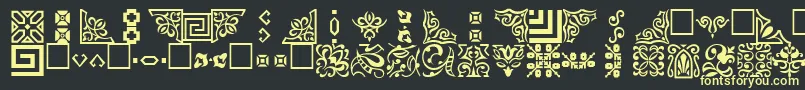 フォントOrnamenttt – 黒い背景に黄色の文字