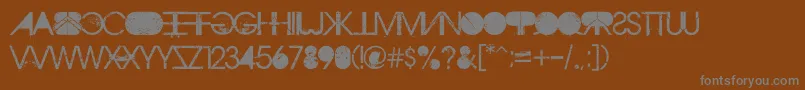 AristotlePunk-fontti – harmaat kirjasimet ruskealla taustalla