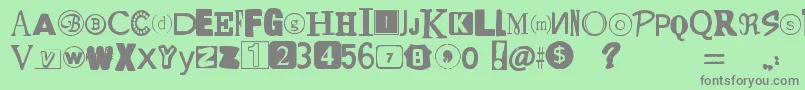 フォントYetAnotherRansomNote – 緑の背景に灰色の文字