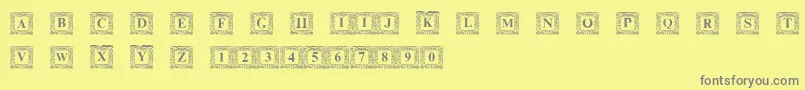 DsInitNormal-fontti – harmaat kirjasimet keltaisella taustalla