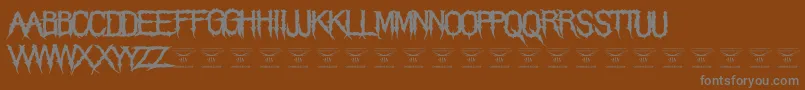 ThegrimraidersRegular-Schriftart – Graue Schriften auf braunem Hintergrund