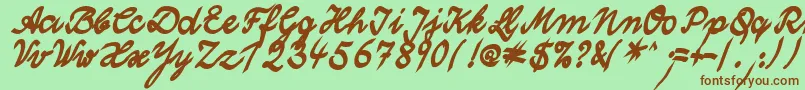 WolgastTwoBold-fontti – ruskeat fontit vihreällä taustalla
