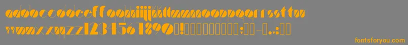 フォントArtistica – オレンジの文字は灰色の背景にあります。