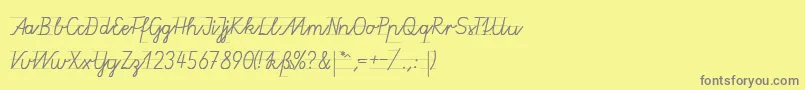 フォントGruenewaldVa1k – 黄色の背景に灰色の文字