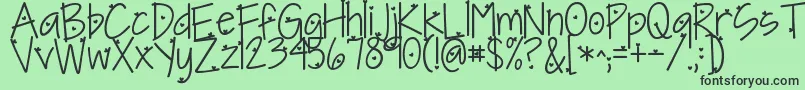 Fonte Kgineedaheartfont – fontes pretas em um fundo verde