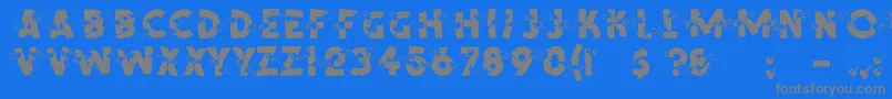 ShrapnelRegular-fontti – harmaat kirjasimet sinisellä taustalla
