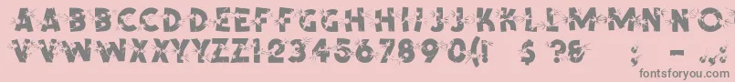 ShrapnelRegular-fontti – harmaat kirjasimet vaaleanpunaisella taustalla