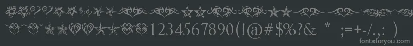 フォントHeartsAndStars – 黒い背景に灰色の文字