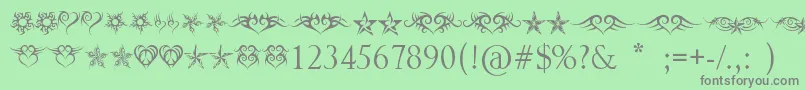 HeartsAndStars Font – Gray Fonts on Green Background