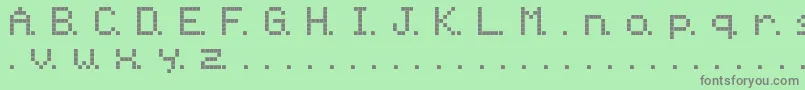 Ninepin-fontti – harmaat kirjasimet vihreällä taustalla