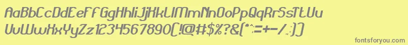 GrandPrixItalic-fontti – harmaat kirjasimet keltaisella taustalla