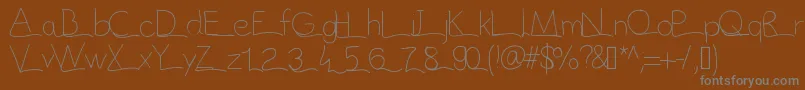 Vague-fontti – harmaat kirjasimet ruskealla taustalla