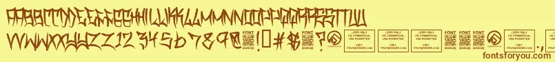 フォントTraviscountyRegular – 茶色の文字が黄色の背景にあります。