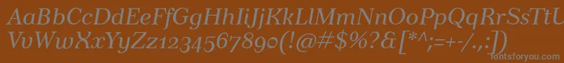 TusarosfItalic-Schriftart – Graue Schriften auf braunem Hintergrund